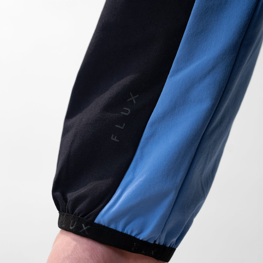 Flux SS26 Versatility Jacket Black/Airforce lifestyle shot — Block P Liverpool