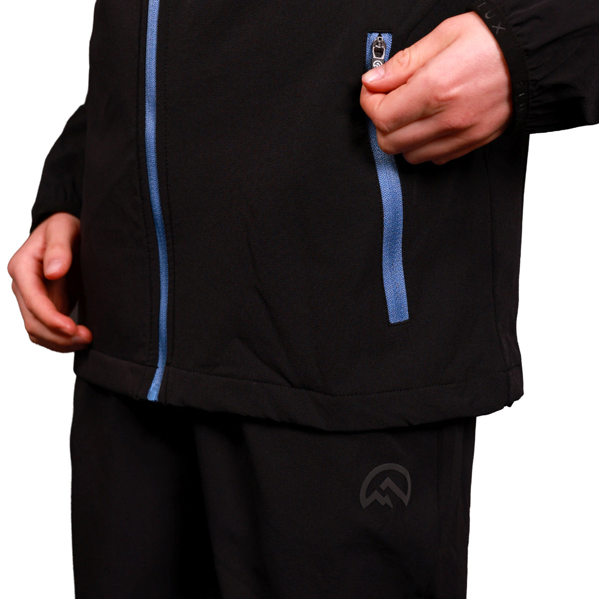 Flux Junior SS26 Versatility Pants Black/Airforce lifestyle shot — Block P Liverpool
